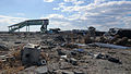 The remains of Shinchi Station, including an E721 series train, after the tsunami in 2011