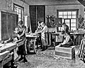 Image 31Students in a carpentry trade school learning woodworking skills, c. 1920 (from Vocational school)