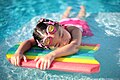 A Chinese girl swimming in a pool