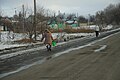 Residents carrying water following the start of the battle in late January 2015