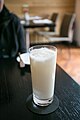 A glass of a coconut-based drink.