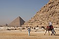 Image 98Tourists riding an Arabian camel in front of Pyramid of Khafre. The Giza Necropolis is one of Egypt's main tourist attractions. (from Egypt)