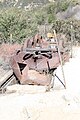 Three 1,600 pound motorized drive wheels and motor armature with a snow plow mounted on rails over the service pit. Recovered in 1993 from the downhill side of Echo Mountain.